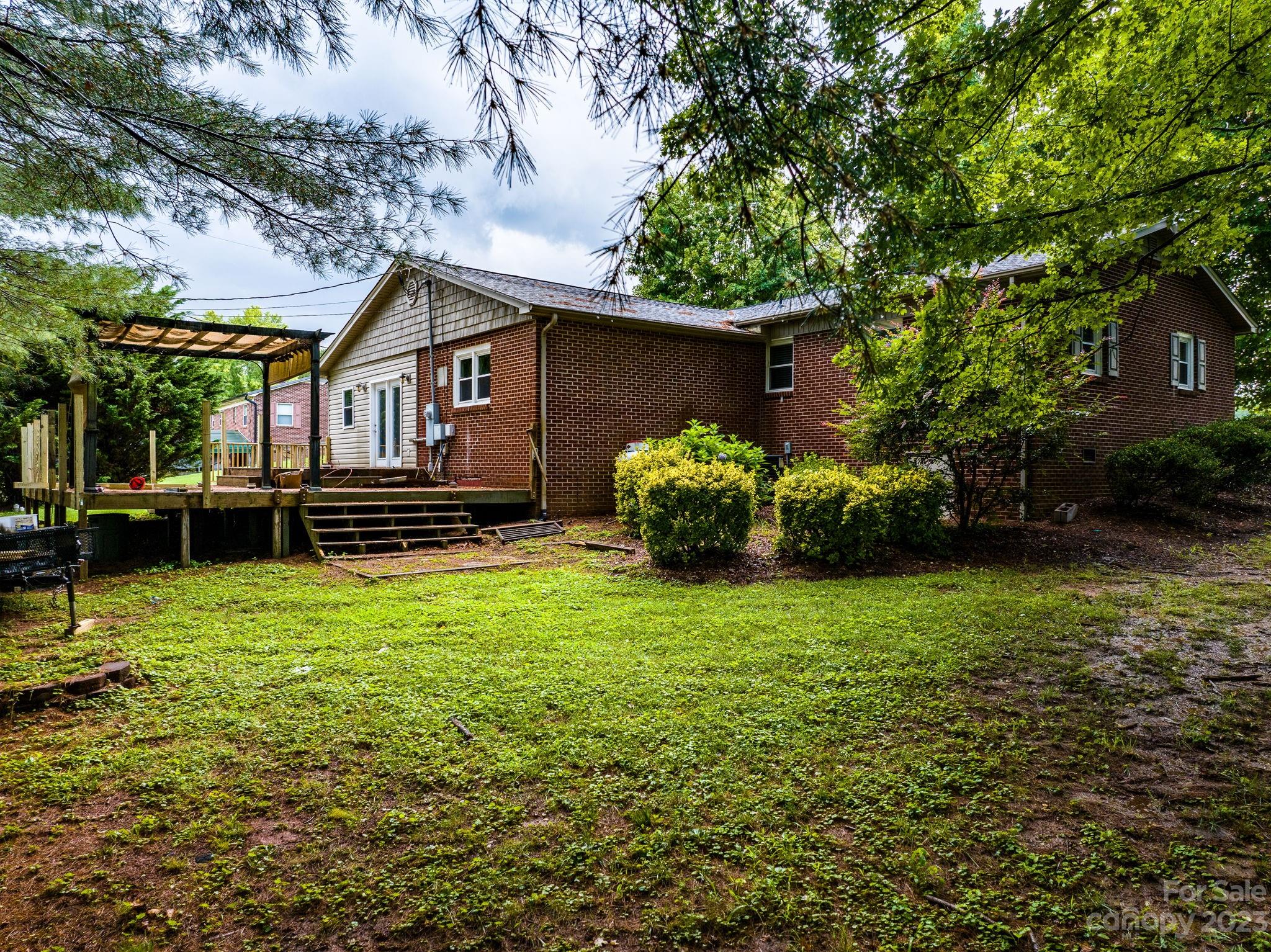 309 Sheldon Street Hudson, NC 28638 - Photo 31 of 40 a front view of a house with garden