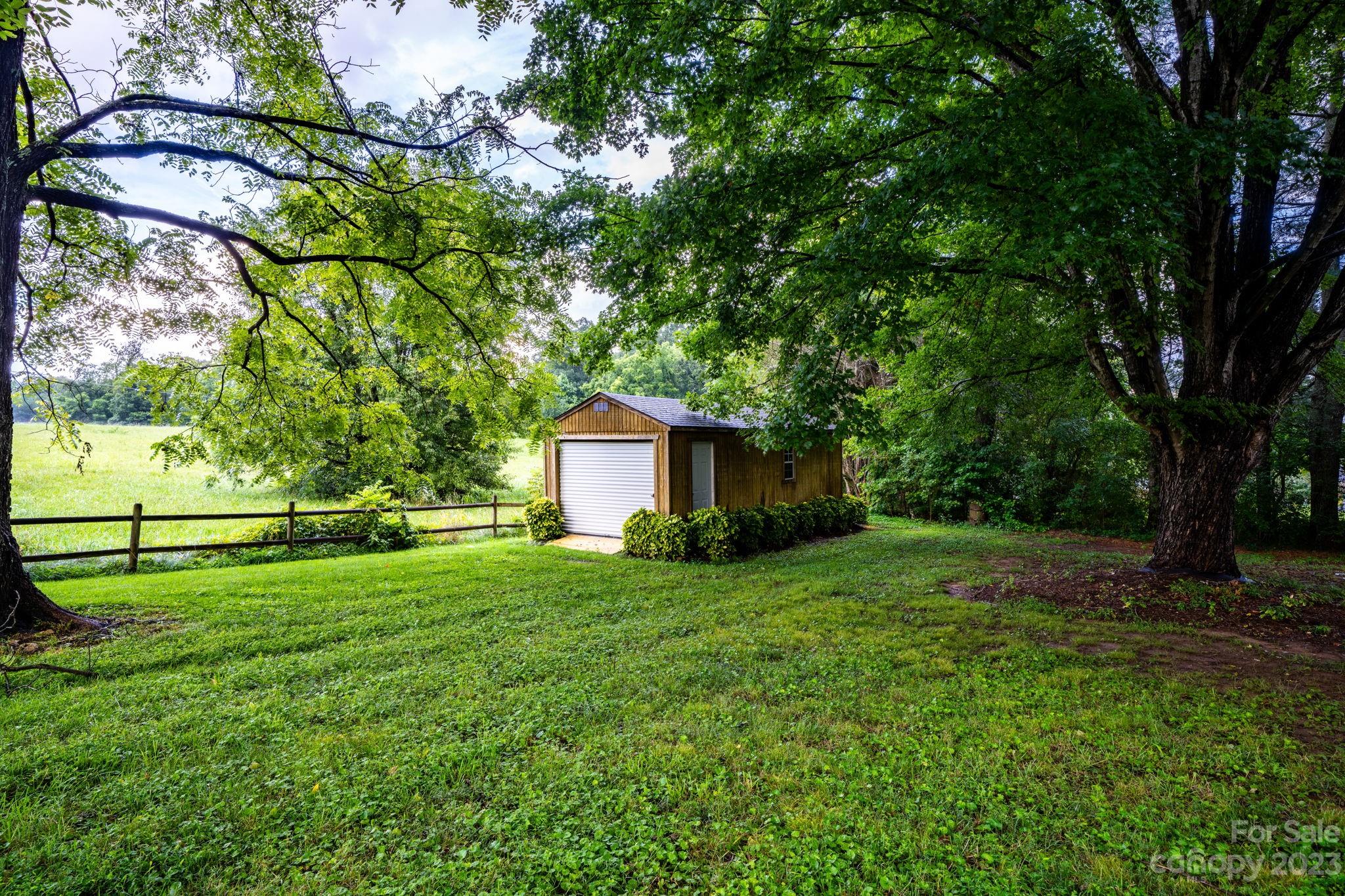 309 Sheldon Street Hudson, NC 28638 - Photo 35 of 40 a view of a house with a yard