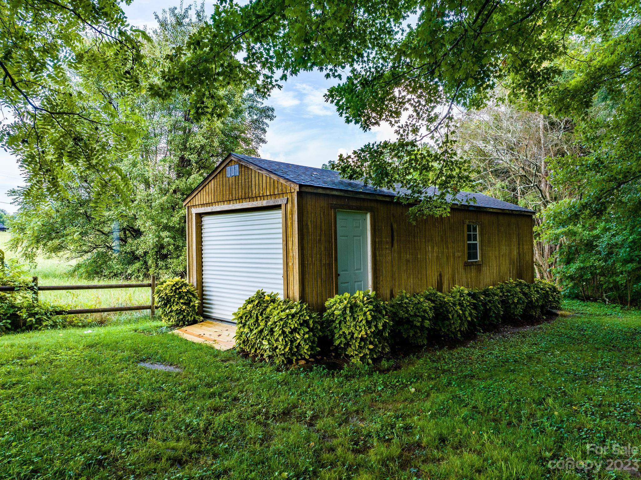 309 Sheldon Street Hudson, NC 28638 - Photo 36 of 40 a front view of a house with garden