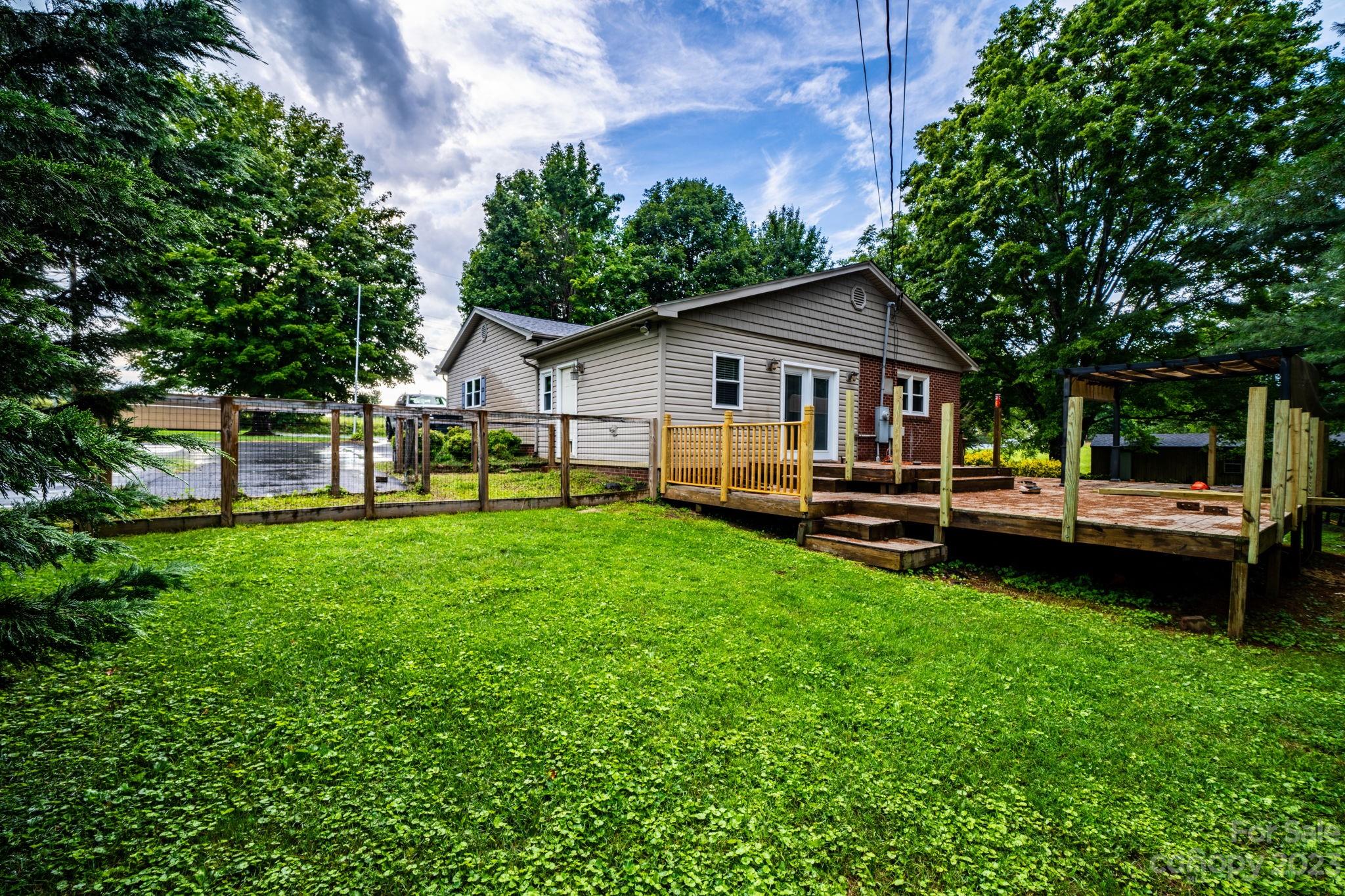 309 Sheldon Street Hudson, NC 28638 - Photo 40 of 40 a backyard of a house with table and chairs