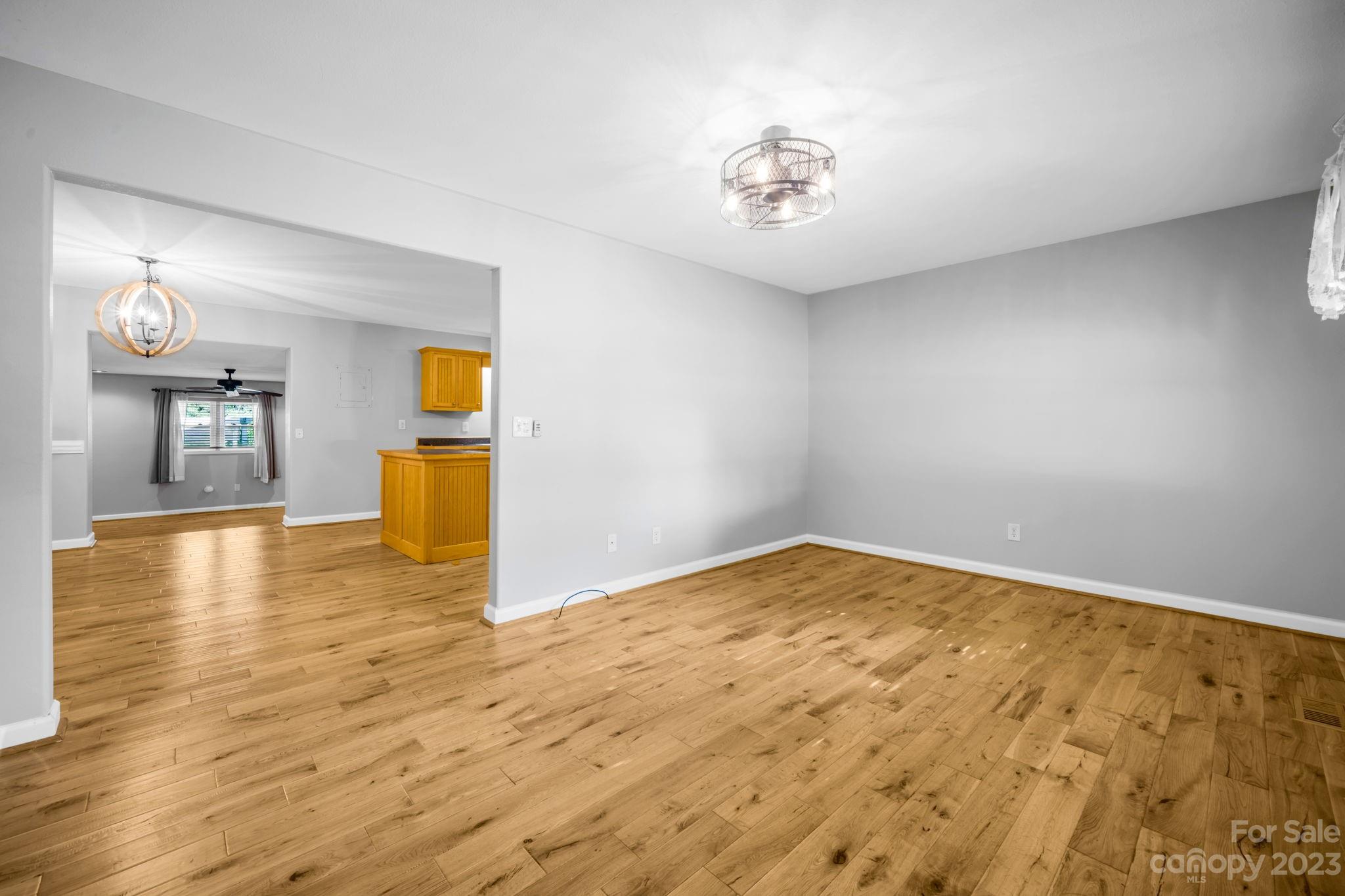309 Sheldon Street Hudson, NC 28638 - Photo 4 of 40 a view of empty room and wooden floor
