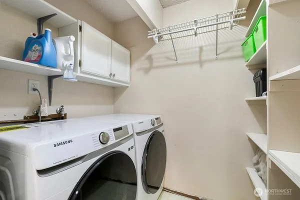 a utility room with dryer and washer