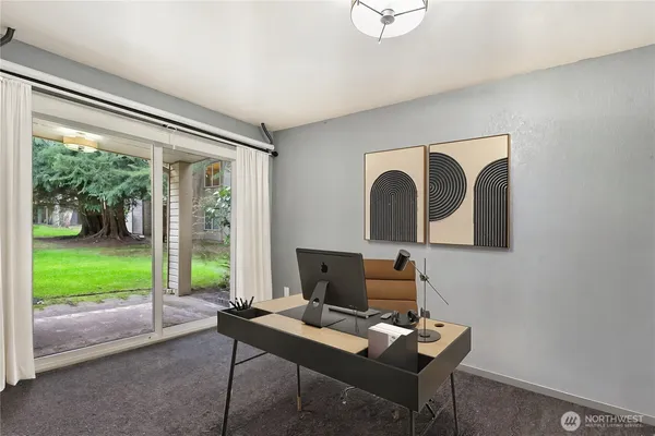 a workspace with furniture and a window