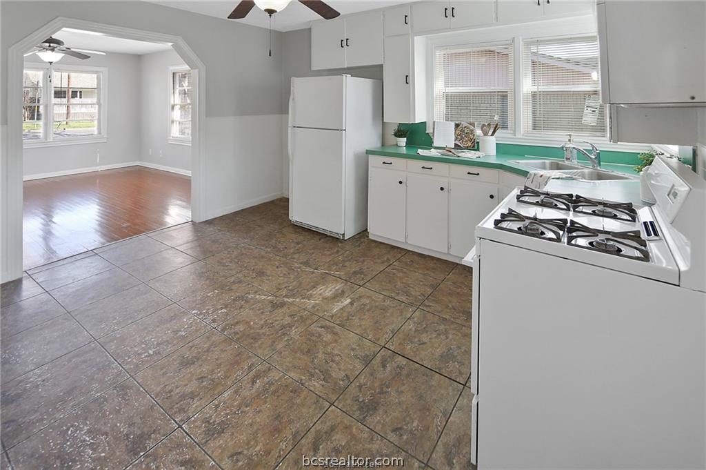 1504 Baker Avenue Bryan, TX 77803 - Photo 8 of 17 a kitchen with refrigerator and window