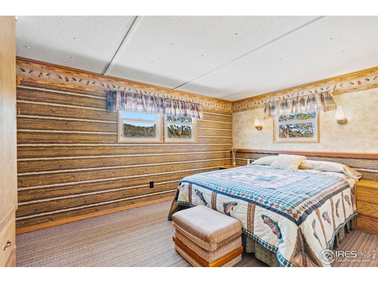 36 Comanche Circle Red Feather Lakes, CO 80545 - Photo 15 of 40 a bathroom with a sink and a mirror