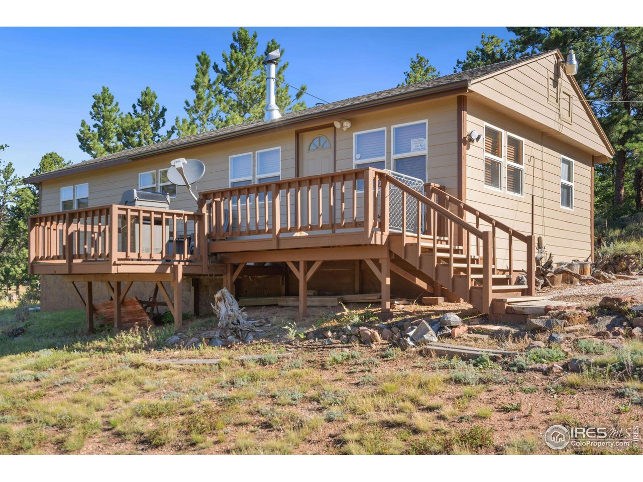36 Comanche Circle Red Feather Lakes, CO 80545 - Photo 2 of 40 a view of a house with a yard