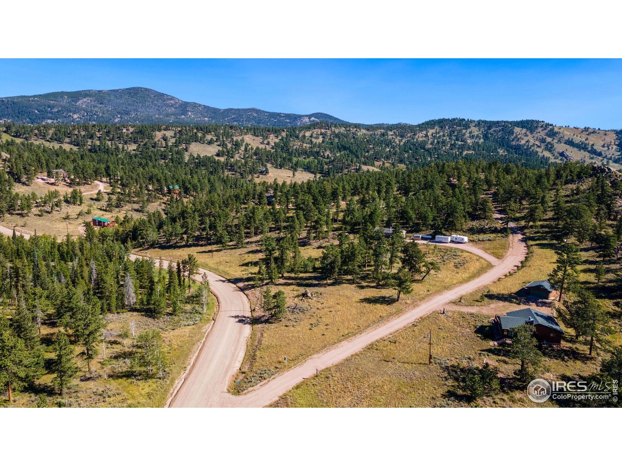 36 Comanche Circle Red Feather Lakes, CO 80545 - Photo 36 of 40 a view of a swimming pool and mountains
