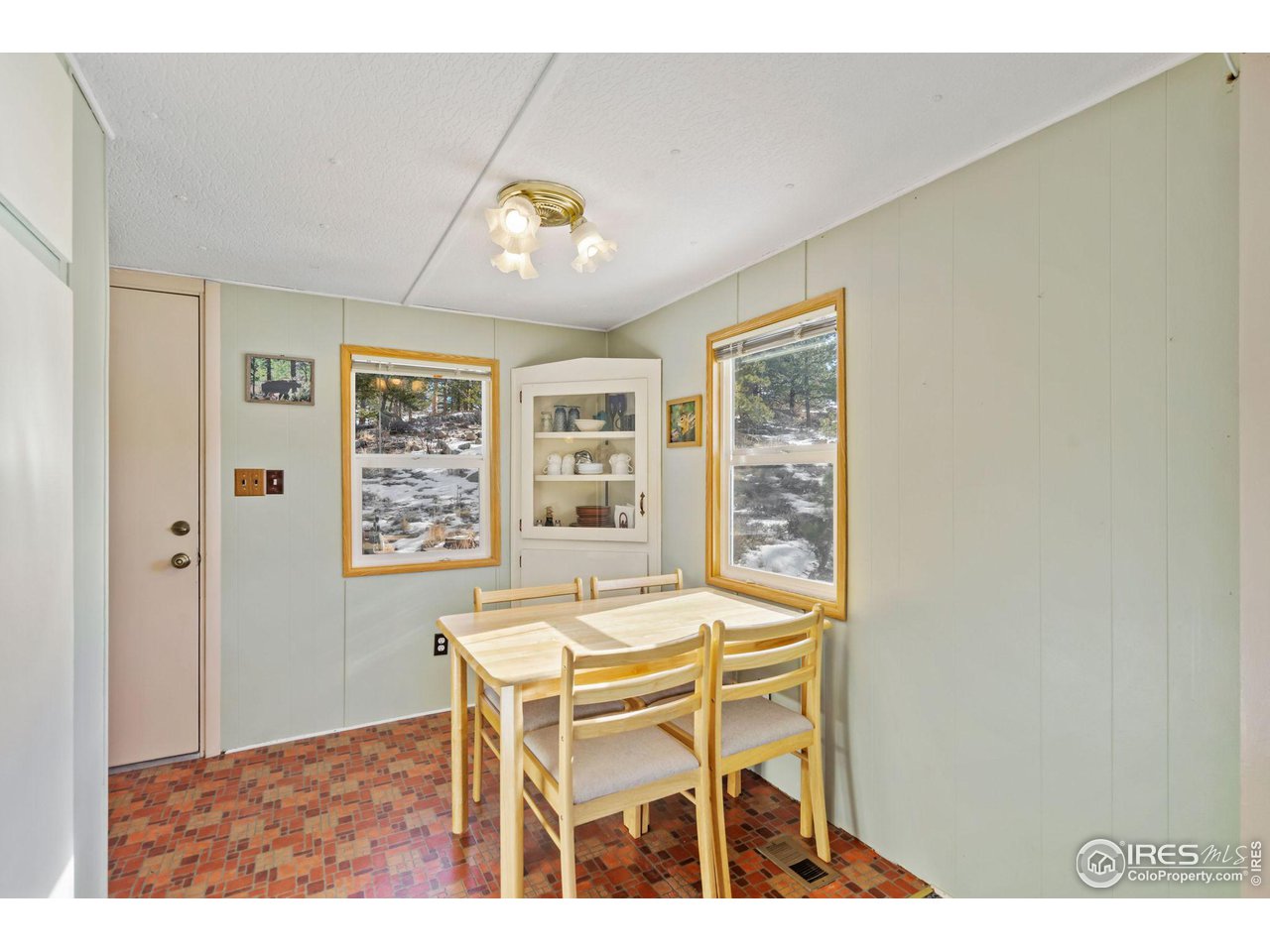 36 Comanche Circle Red Feather Lakes, CO 80545 - Photo 8 of 40 a view of a dining room with furniture and a window