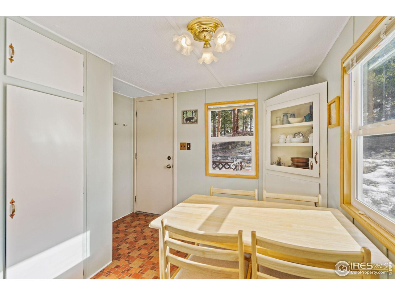 36 Comanche Circle Red Feather Lakes, CO 80545 - Photo 10 of 40 a bedroom with a bed and a window