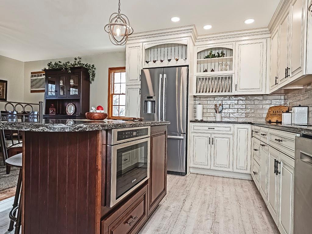 108 Metzler Road Apollo, PA 15613 - Photo 4 of 25 a kitchen with stainless steel appliances a stove a sink and cabinets