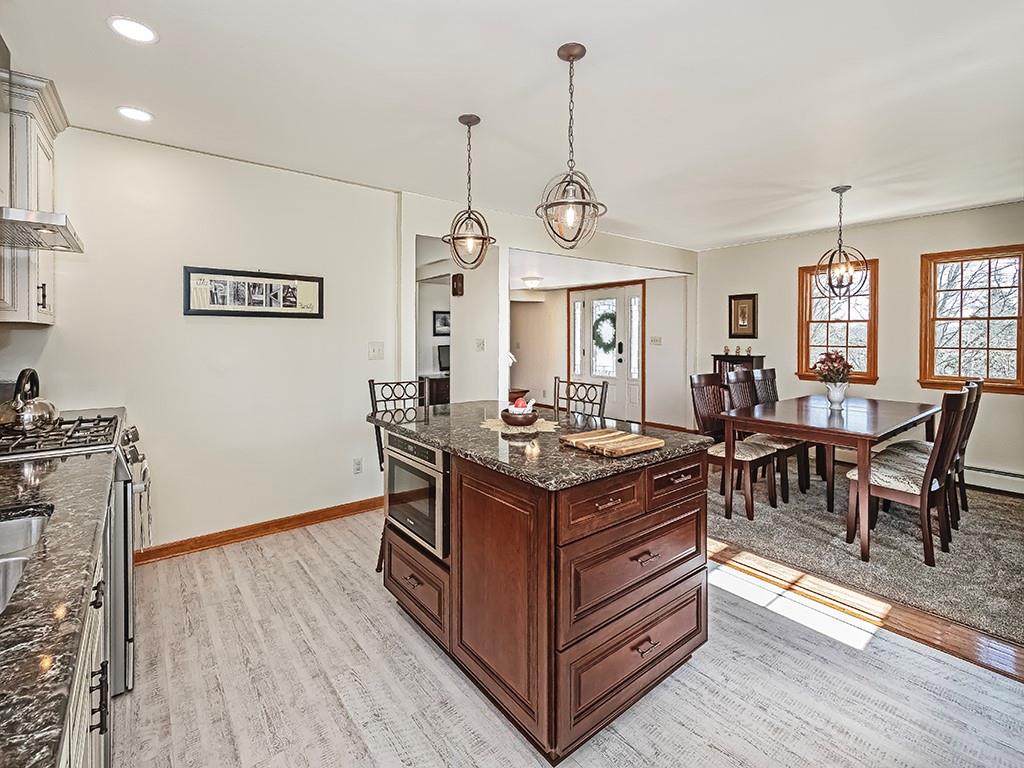 108 Metzler Road Apollo, PA 15613 - Photo 6 of 25 a kitchen with a stove and wooden floor