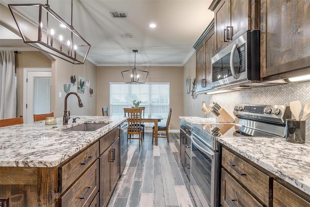 850 McClendon Walker Road Aledo, TX 76008 - Photo 15 of 38 a kitchen with granite countertop lots of counter top space and stainless steel appliances