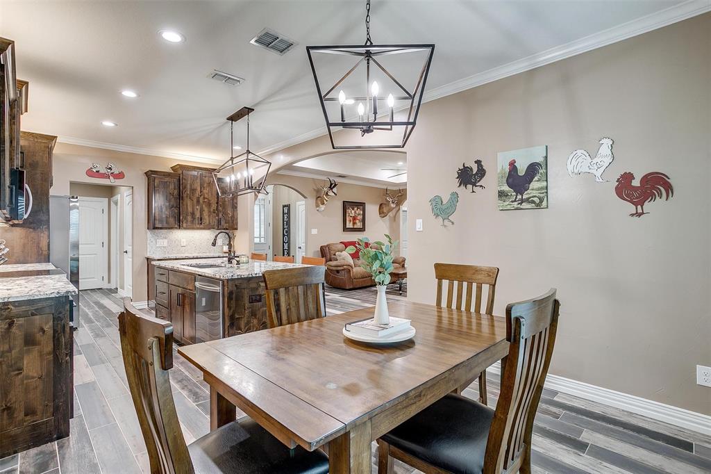 850 McClendon Walker Road Aledo, TX 76008 - Photo 18 of 38 a view of a dining room with furniture and a chandelier
