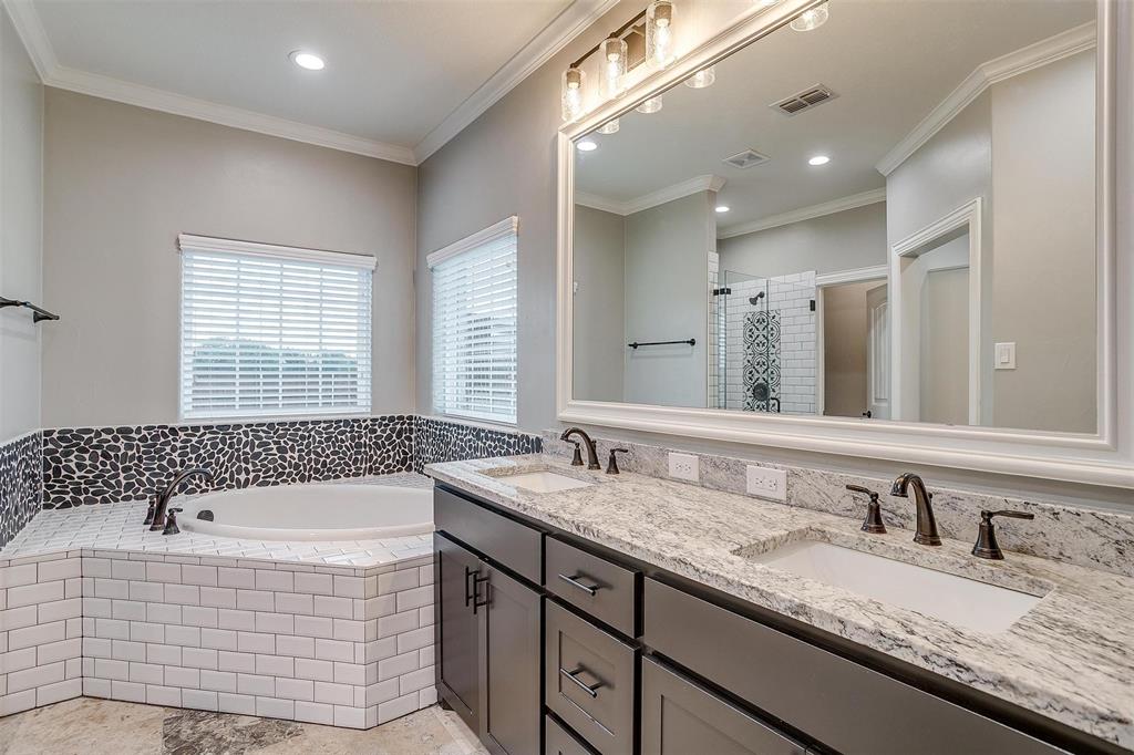 850 McClendon Walker Road Aledo, TX 76008 - Photo 22 of 38 a bathroom with a granite countertop tub a double vanity sink and mirror