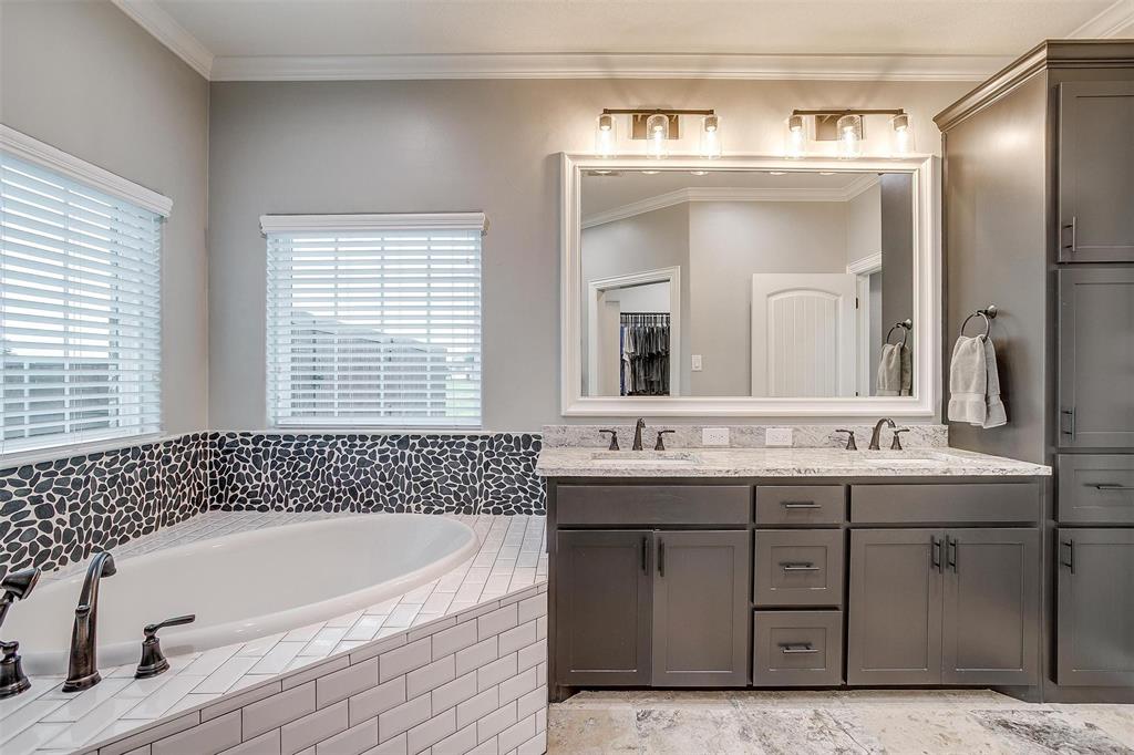 850 McClendon Walker Road Aledo, TX 76008 - Photo 24 of 38 a bathroom with a bathtub a double vanity sink and mirror