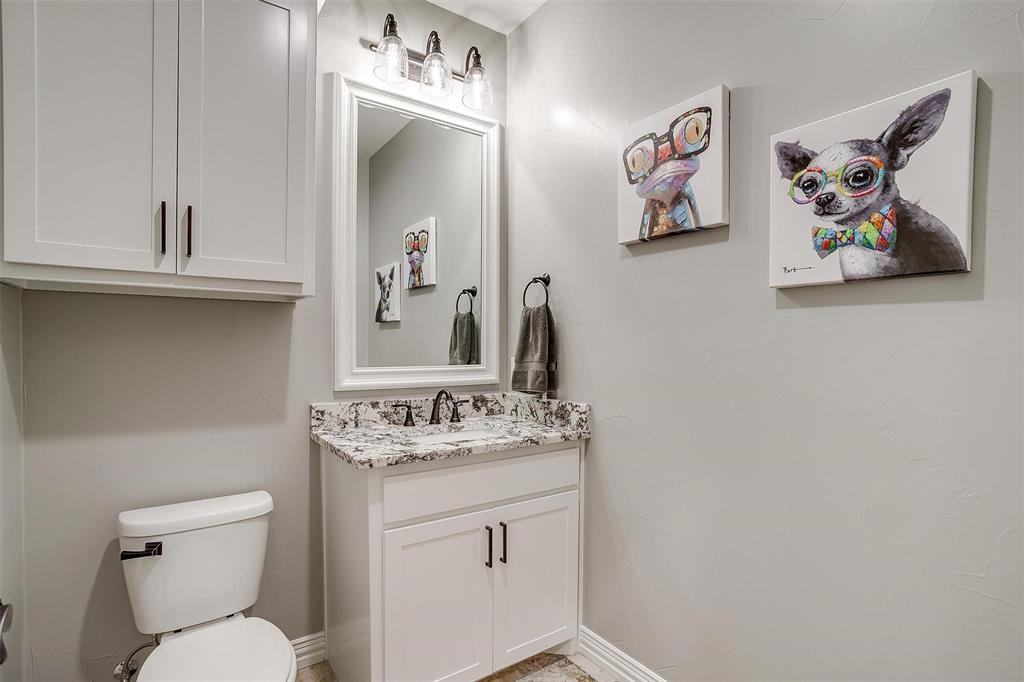 850 McClendon Walker Road Aledo, TX 76008 - Photo 31 of 38 a bathroom with a toilet a sink and mirror