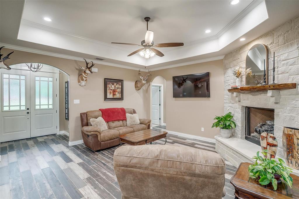 850 McClendon Walker Road Aledo, TX 76008 - Photo 10 of 38 a living room with furniture and a fireplace