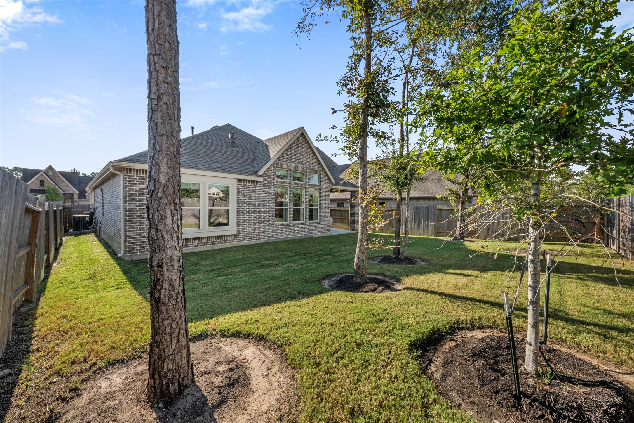 15650 Turtlehead Trail Conroe, TX 77302 - Photo 26 of 41 a view of a house with a yard