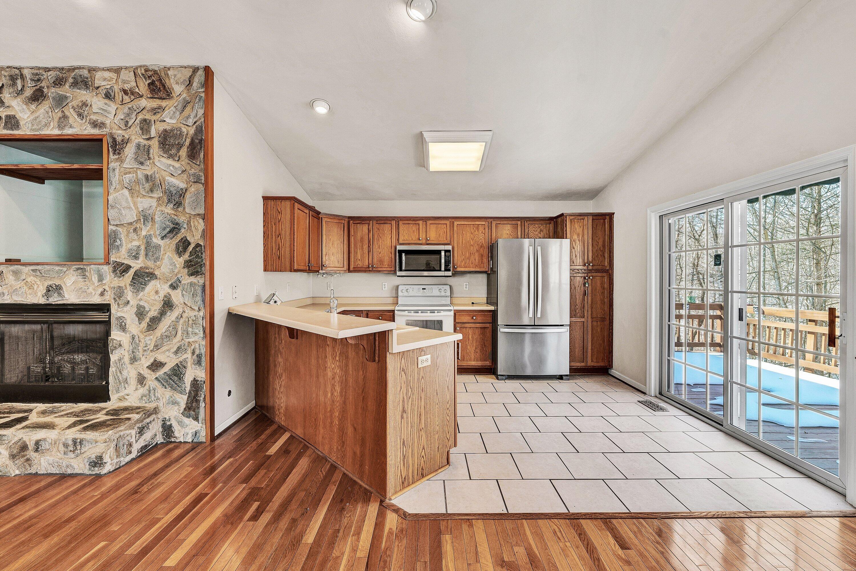 25 Walnut Landing Circle Hardy, VA 24101 - Photo 12 of 56 a kitchen with stainless steel appliances a stove top oven and a refrigerator