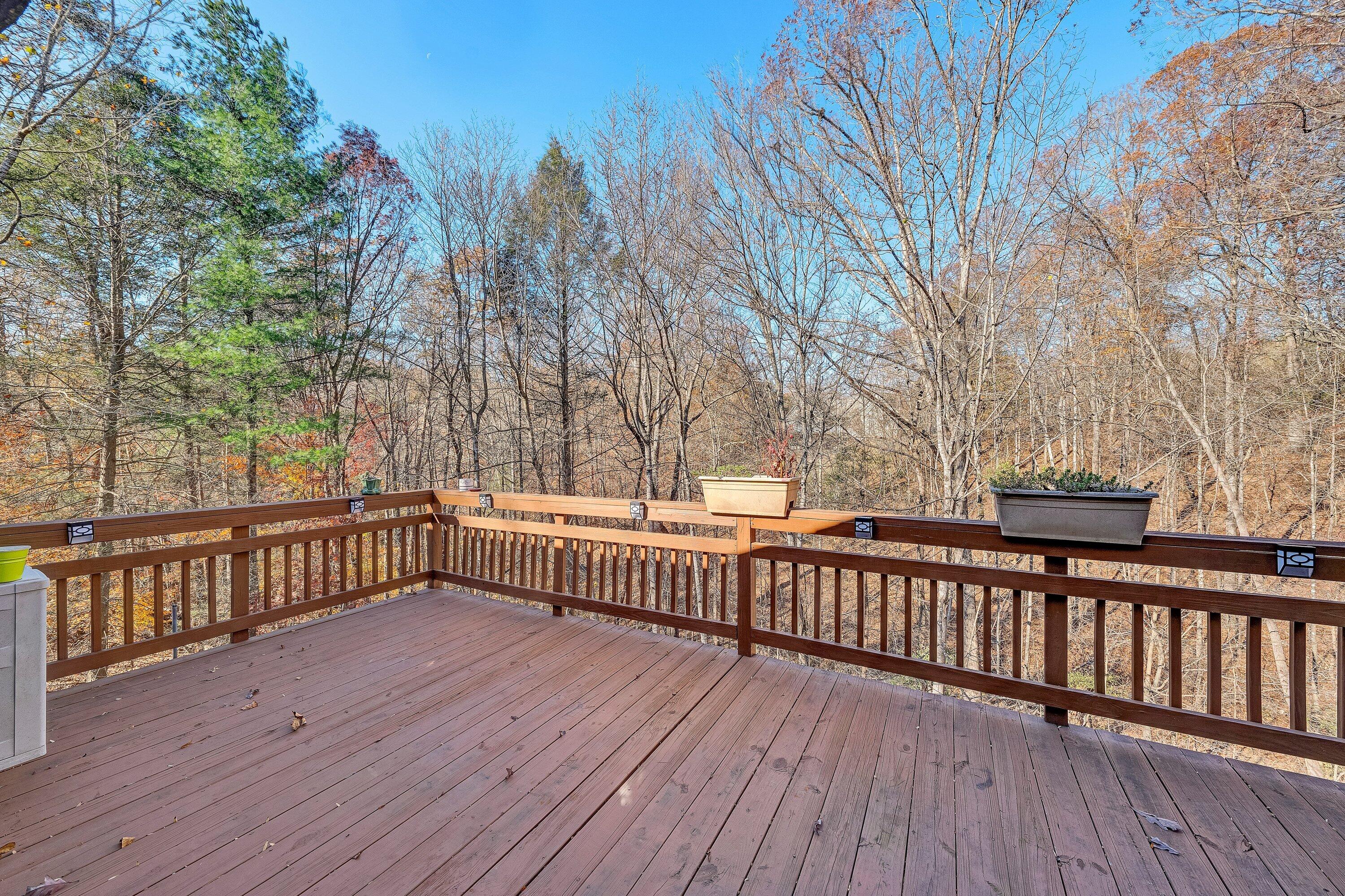 25 Walnut Landing Circle Hardy, VA 24101 - Photo 21 of 56 a view of deck with large trees and wooden fence