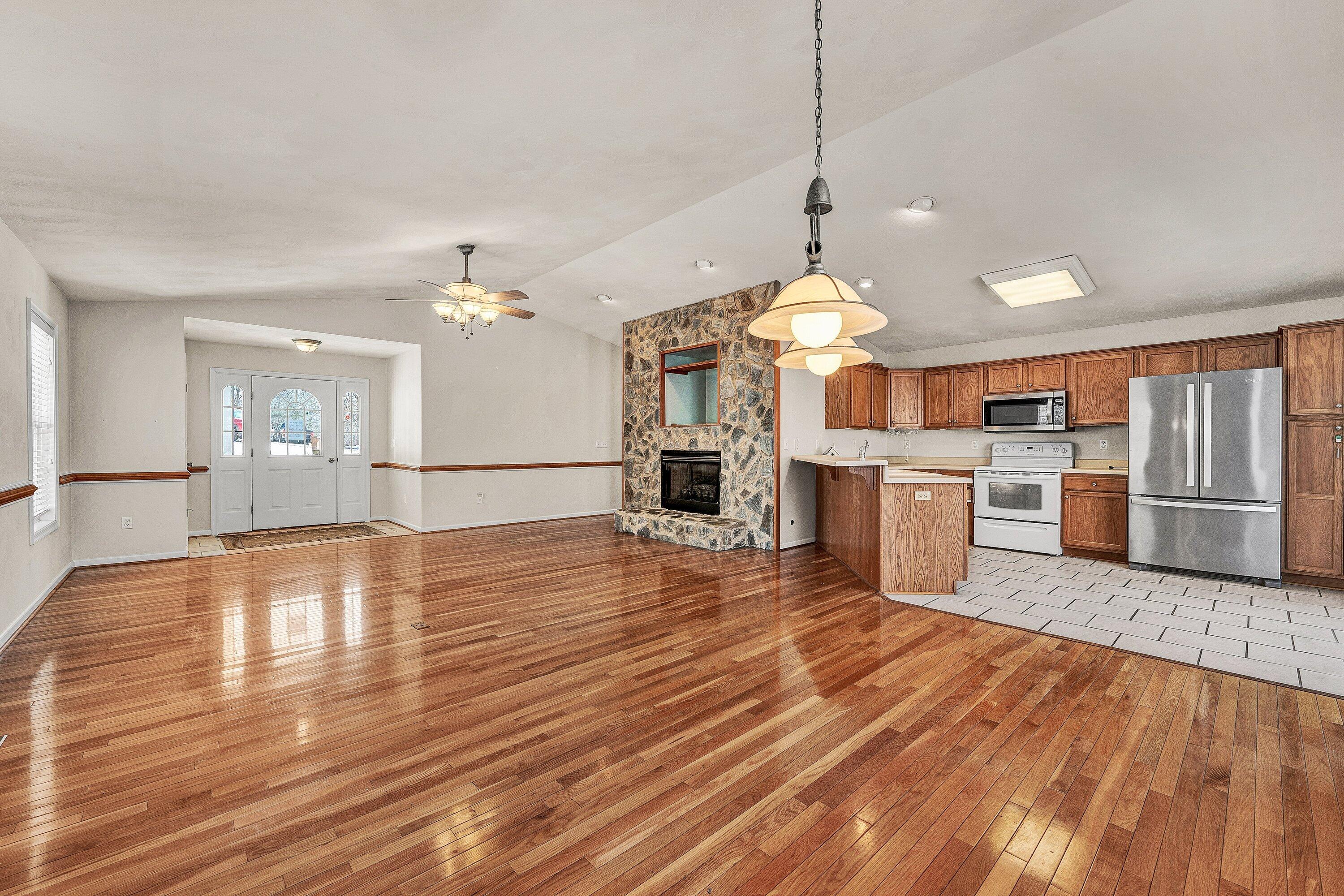 25 Walnut Landing Circle Hardy, VA 24101 - Photo 8 of 56 a view of a kitchen with a stove cabinets and wooden floor