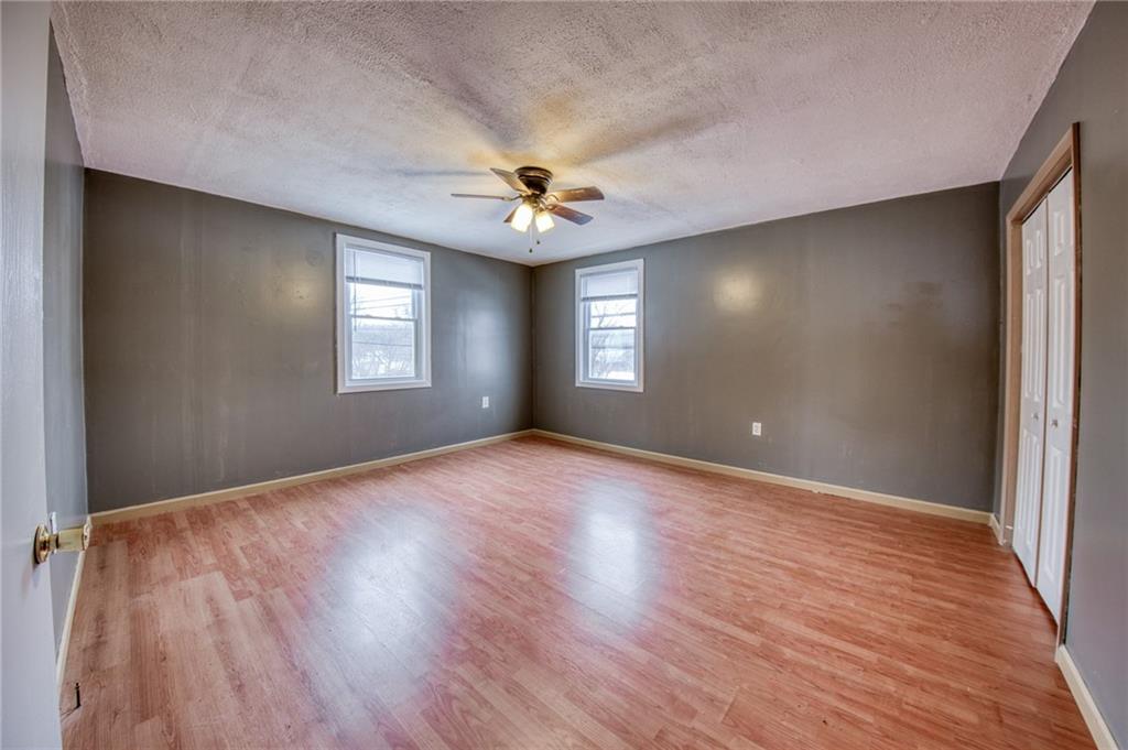 1920 Smith Township State Road Burgettstown, PA 15021 - Photo 20 of 41 a view of an empty room with window and wooden floor