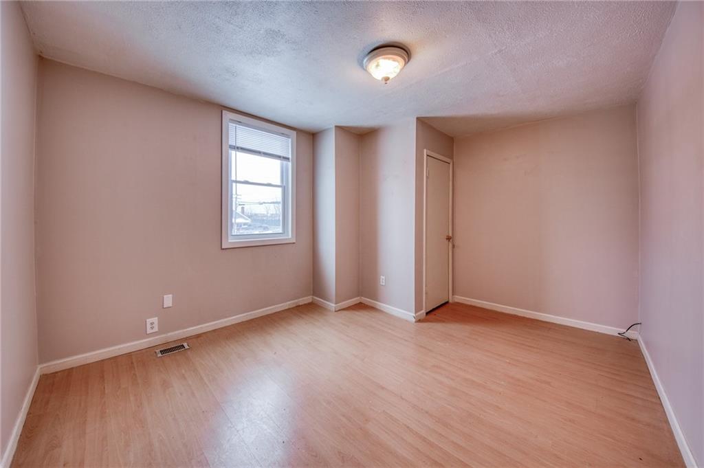 1920 Smith Township State Road Burgettstown, PA 15021 - Photo 28 of 41 an empty room with wooden floor and windows