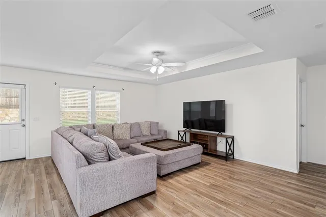 a kitchen with stainless steel appliances granite countertop a sink stove microwave and refrigerator