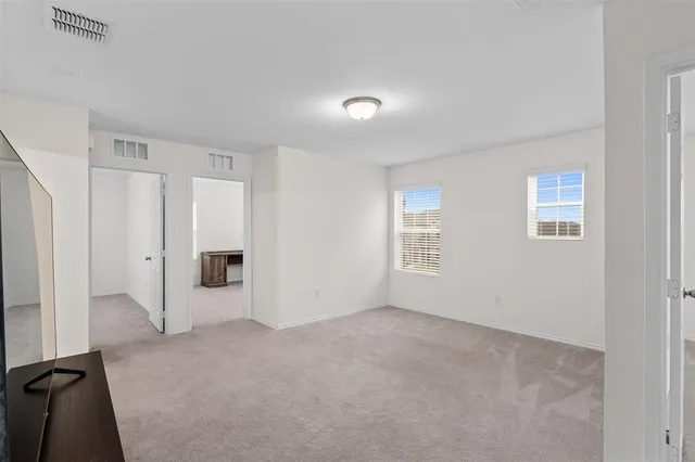 a bathroom with a sink toilet and a mirror