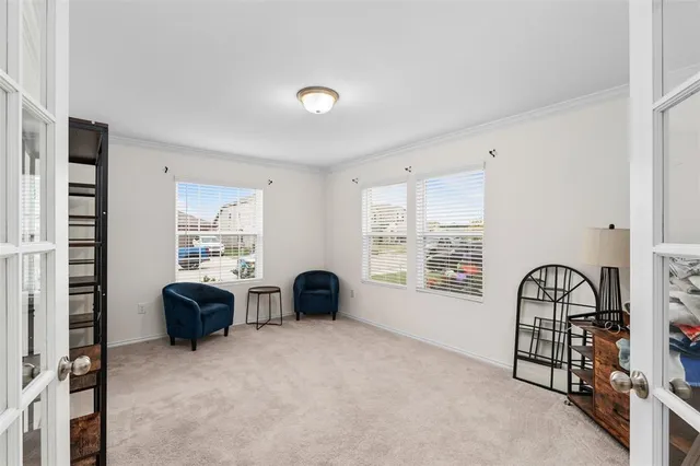 a view of workspace with wooden floor and windows