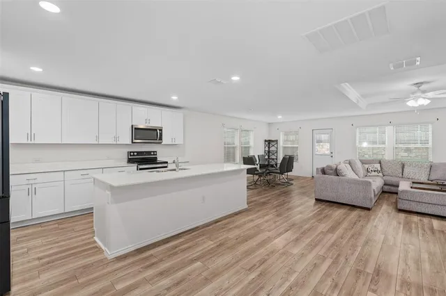 a view of a house with a yard and a porch