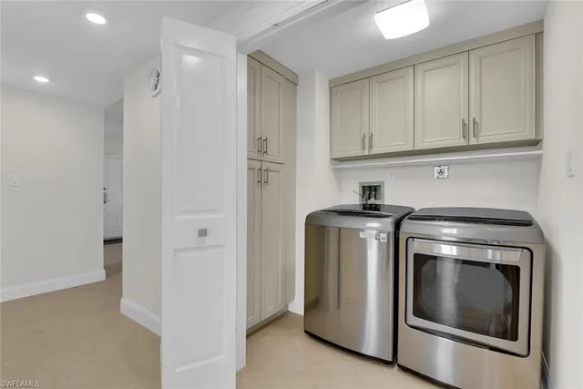 a view of a garden with plants and a bench