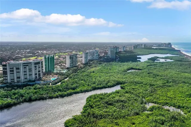 a view of a garden with a building in the background
