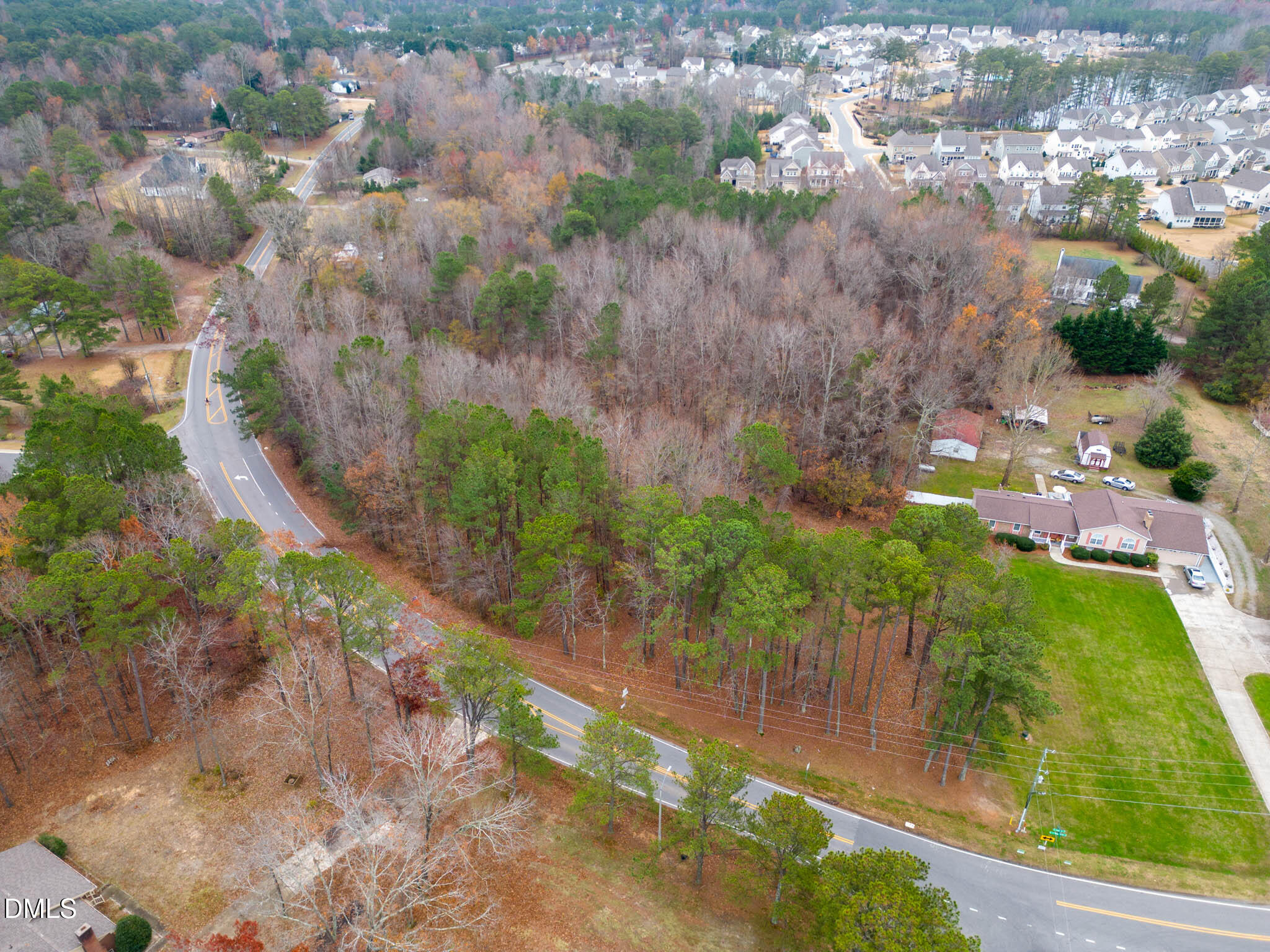 7808 Stephenson Road Apex, NC 27539 - Photo 6 of 7 an aerial view of residential houses with outdoor space