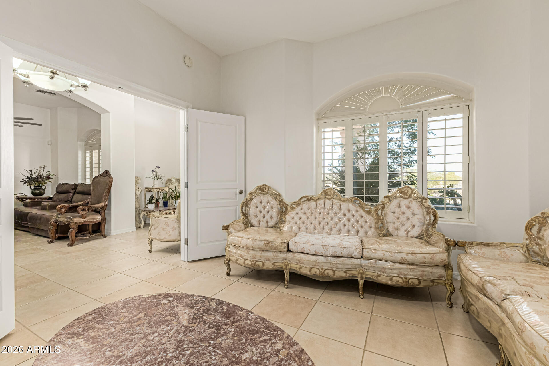 12607 West Ocotillo Road Glendale, AZ 85307 - Photo 17 of 52 a living room with furniture and a large window