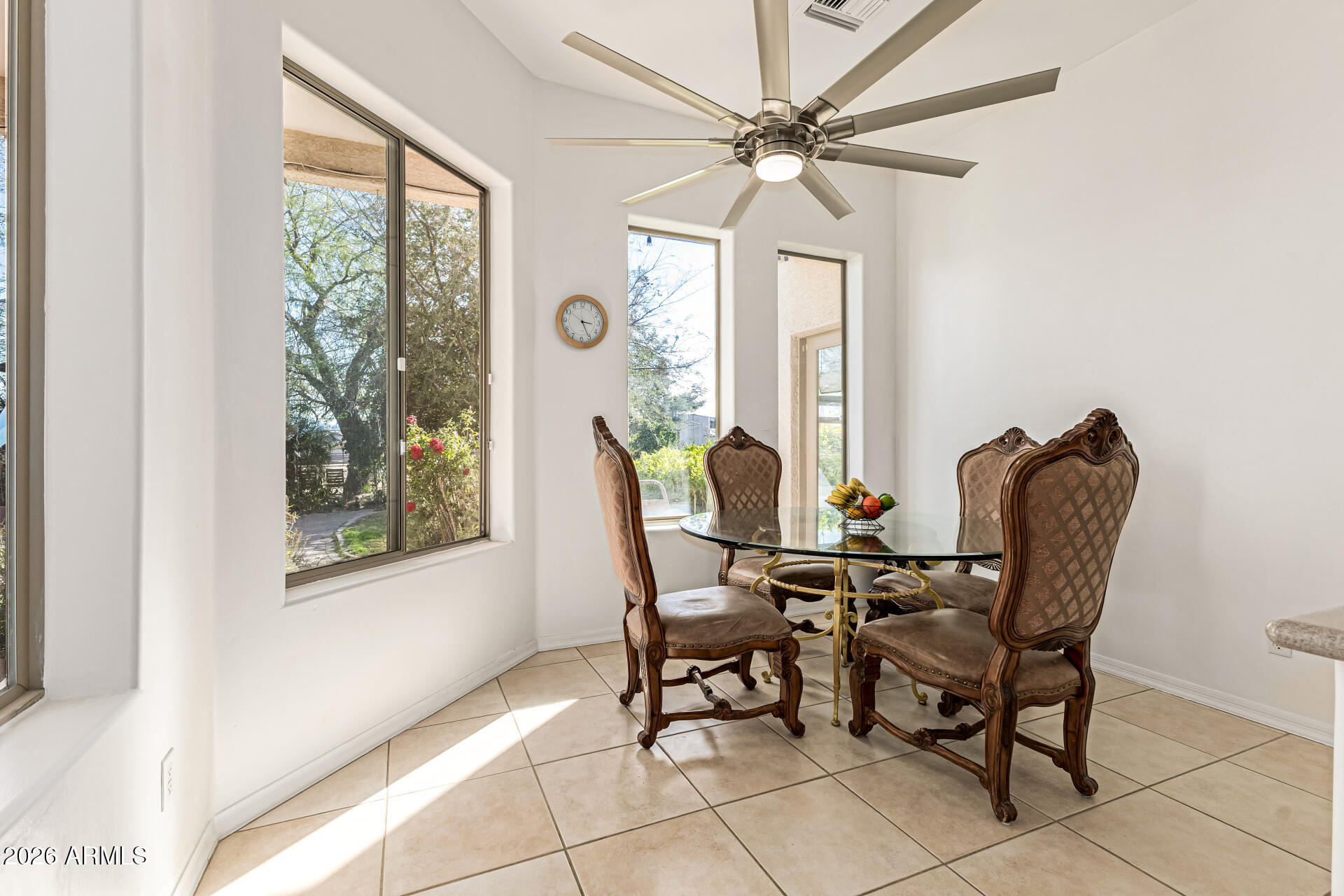 12607 West Ocotillo Road Glendale, AZ 85307 - Photo 18 of 52 a view of a dining room with furniture and a window