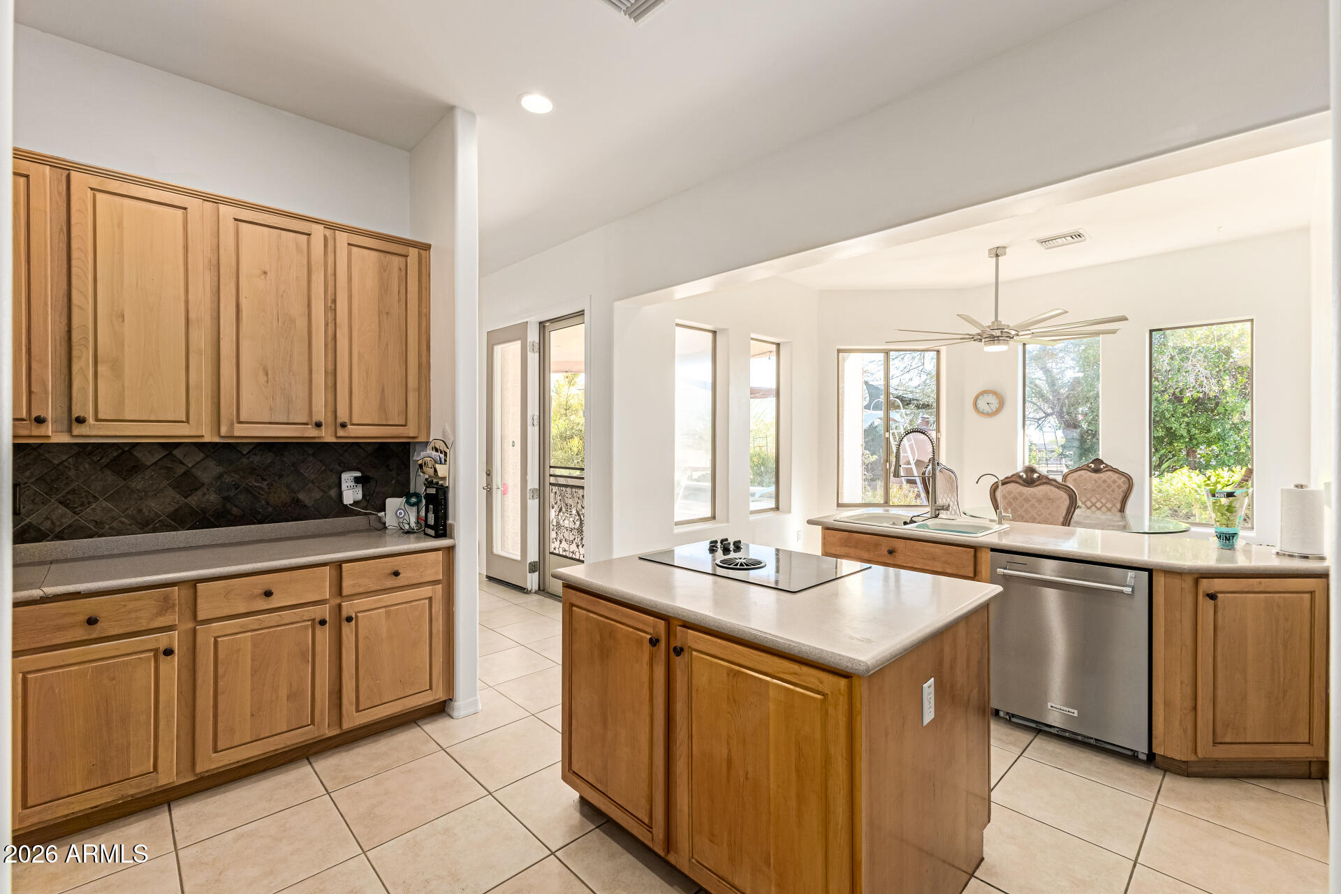 12607 West Ocotillo Road Glendale, AZ 85307 - Photo 21 of 52 a kitchen with a sink stove and cabinets