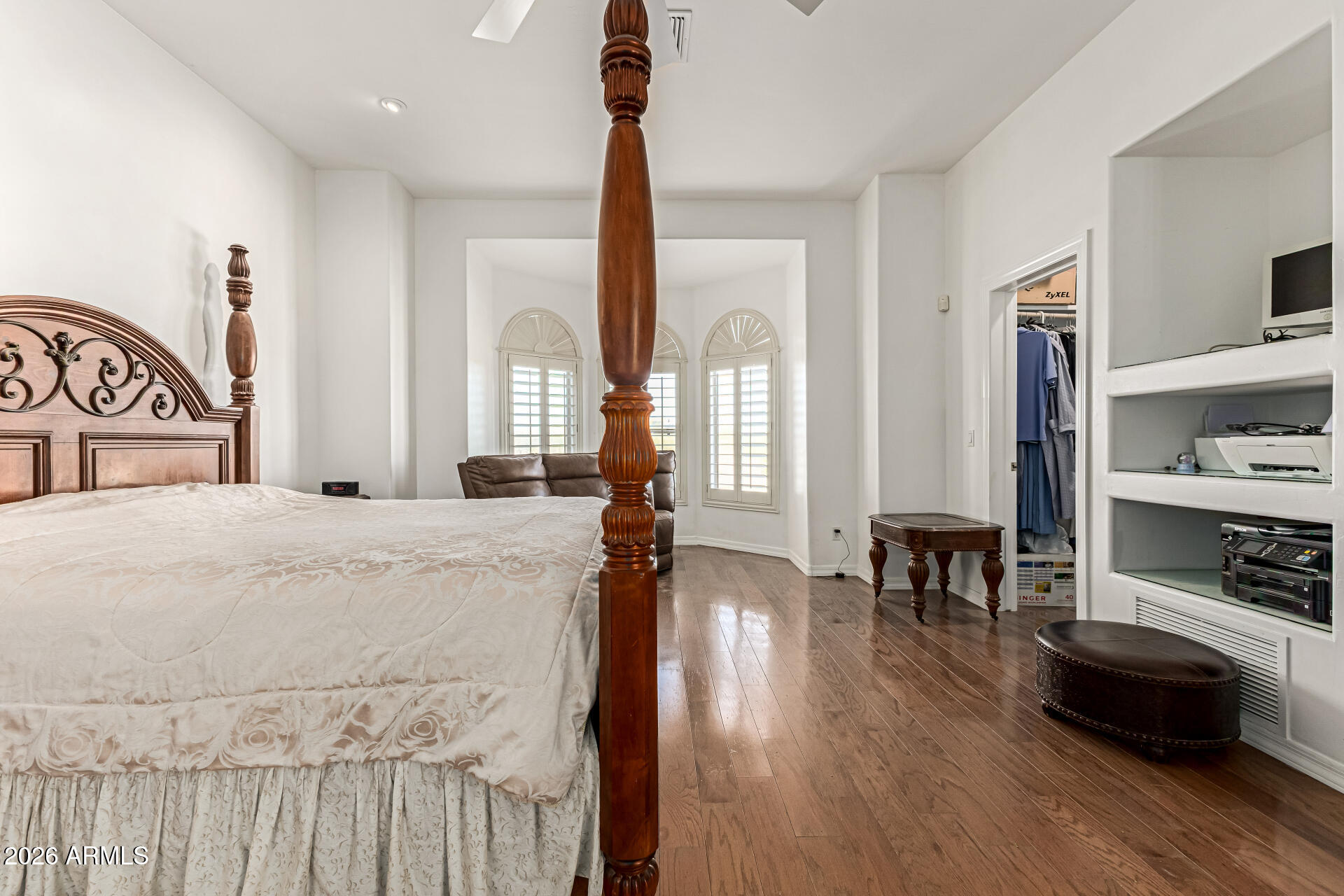 12607 West Ocotillo Road Glendale, AZ 85307 - Photo 24 of 52 a bedroom with furniture and a wooden floor