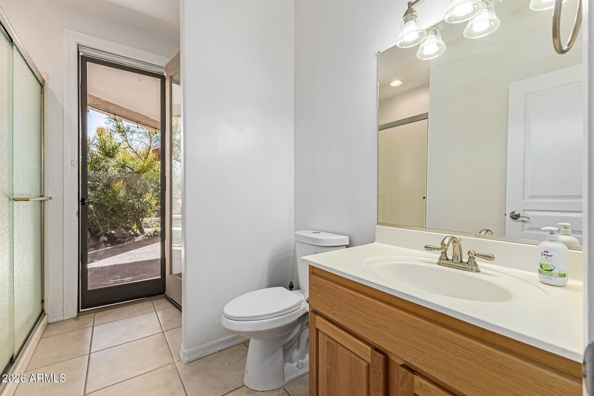 12607 West Ocotillo Road Glendale, AZ 85307 - Photo 27 of 52 a bathroom with a sink a toilet and large mirror