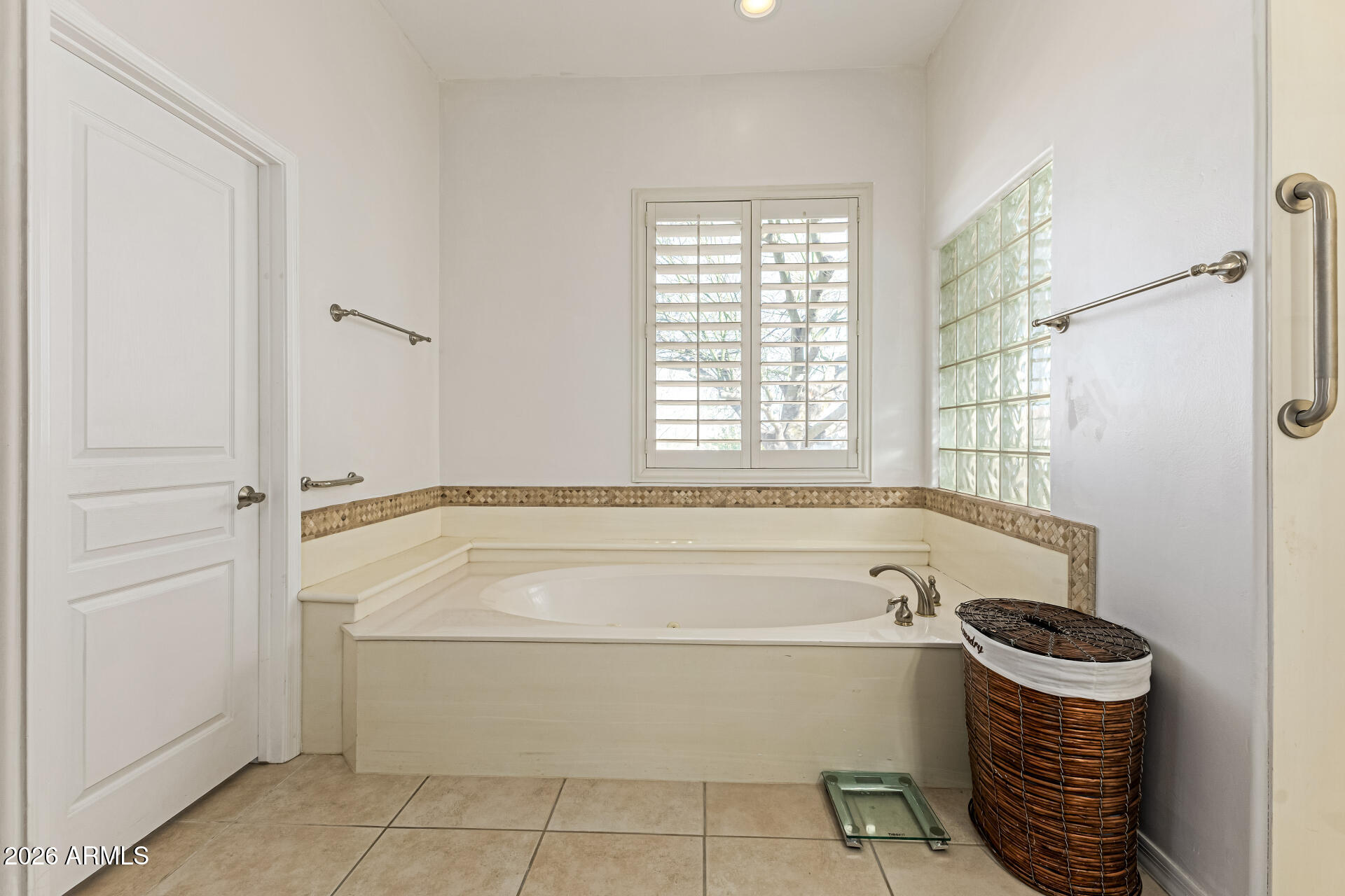 12607 West Ocotillo Road Glendale, AZ 85307 - Photo 29 of 52 a bathroom with a bathtub and a shower