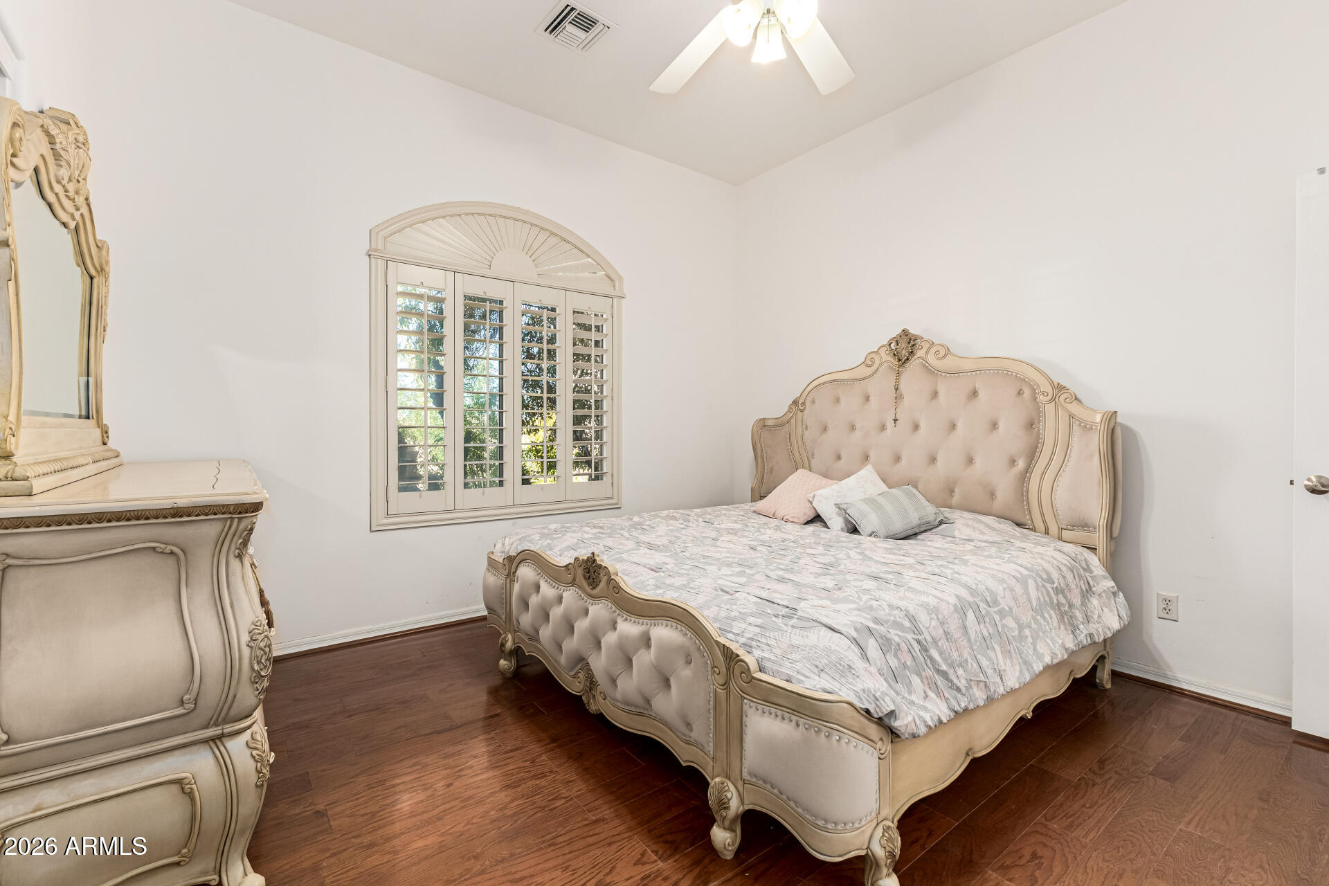 12607 West Ocotillo Road Glendale, AZ 85307 - Photo 31 of 52 a bedroom with a bed and a couch