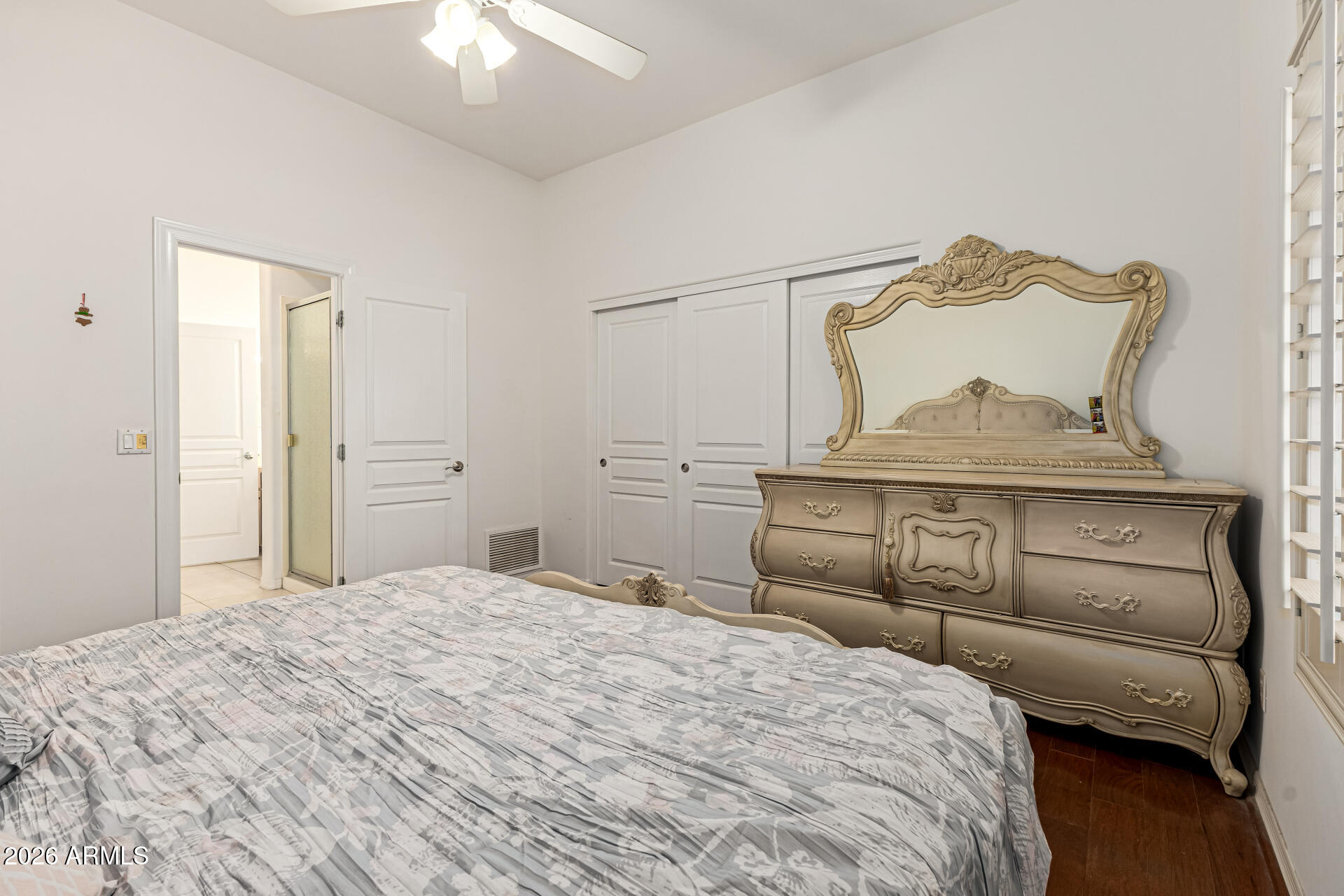 12607 West Ocotillo Road Glendale, AZ 85307 - Photo 32 of 52 a bedroom with a bed and a chandelier