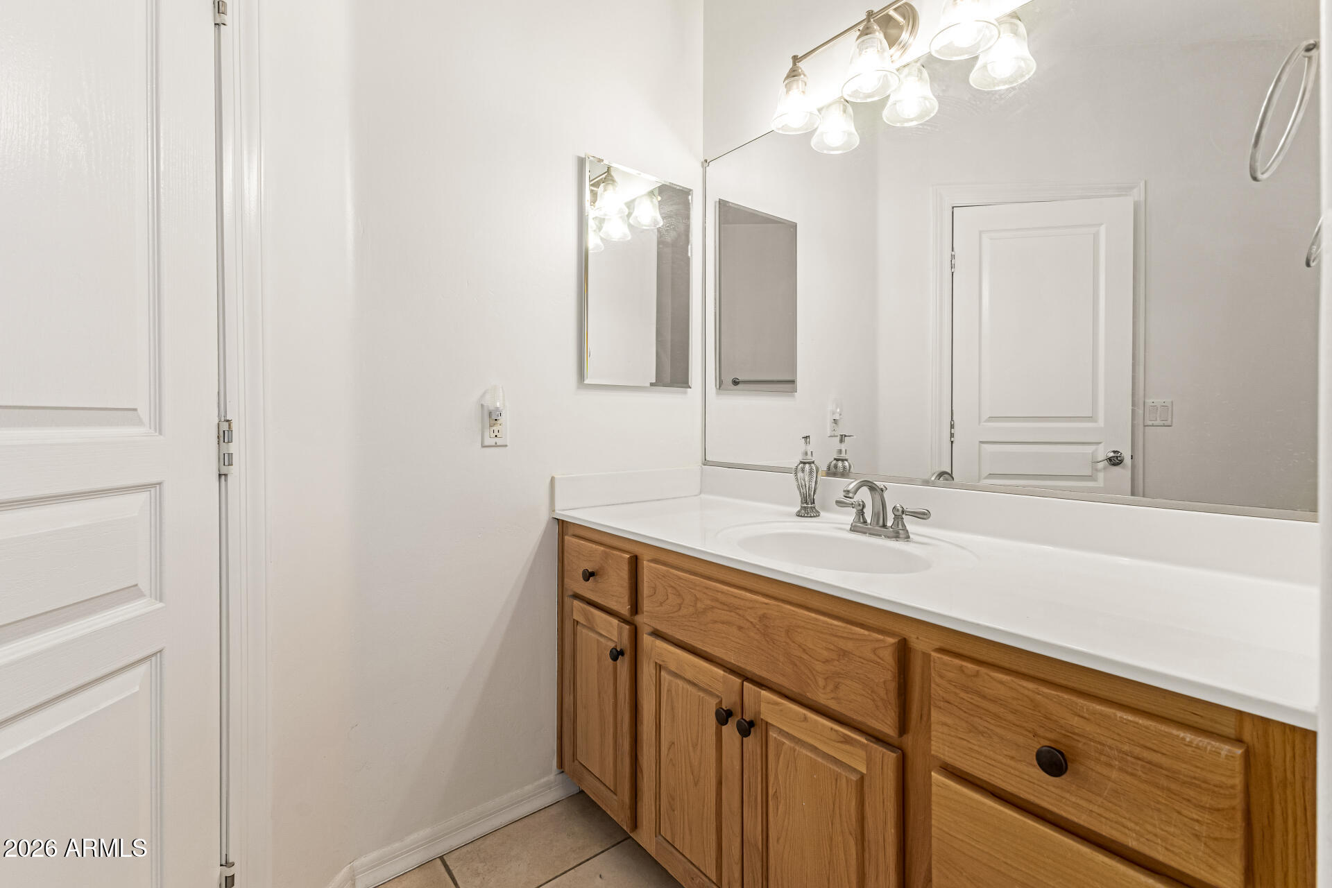 12607 West Ocotillo Road Glendale, AZ 85307 - Photo 34 of 52 a bathroom with a sink and a mirror