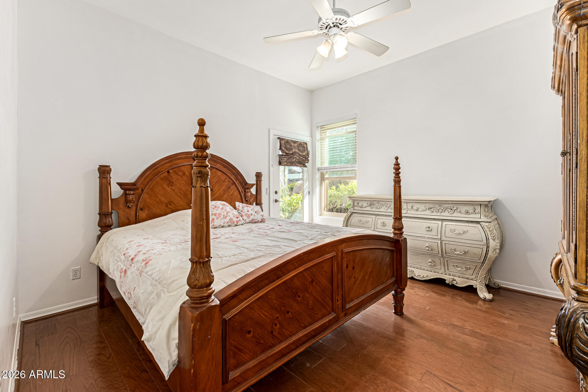 12607 West Ocotillo Road Glendale, AZ 85307 - Photo 35 of 52 a bed sitting in a room next to a window with pc on the wall