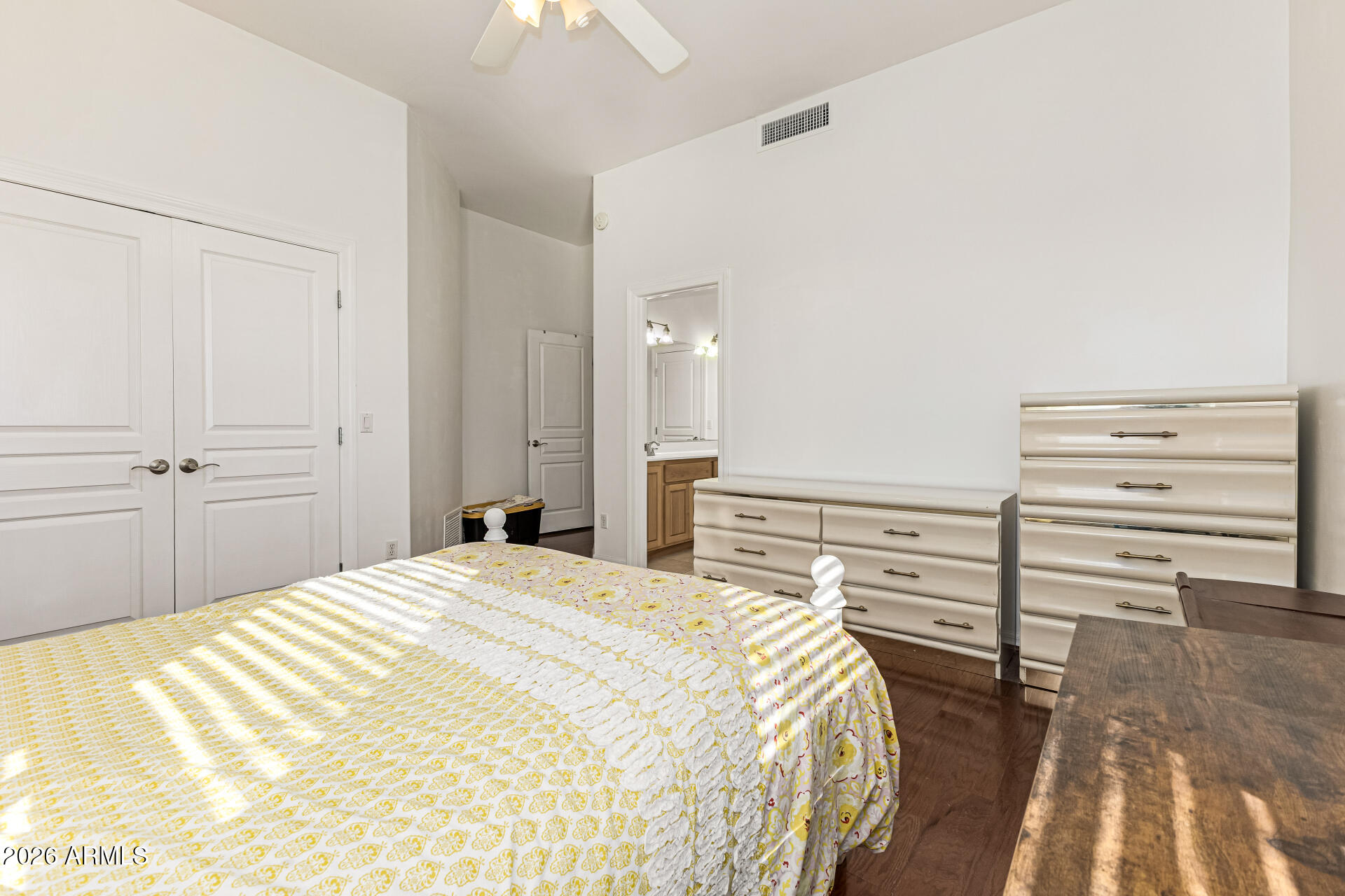 12607 West Ocotillo Road Glendale, AZ 85307 - Photo 38 of 52 a bedroom with a bed and cabinets