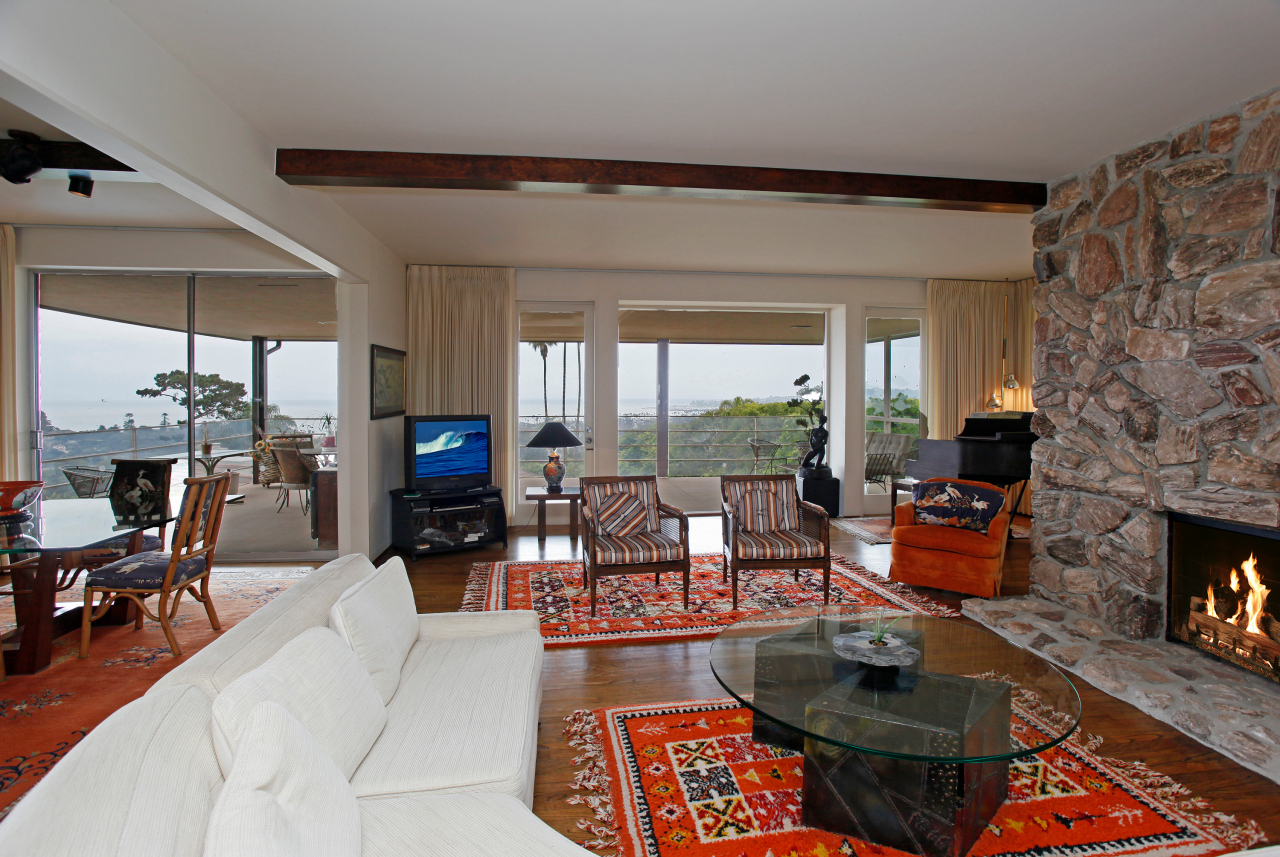133 Rametto Road Montecito, CA 93108 - Photo 12 of 12 a living room with fireplace furniture and a large window