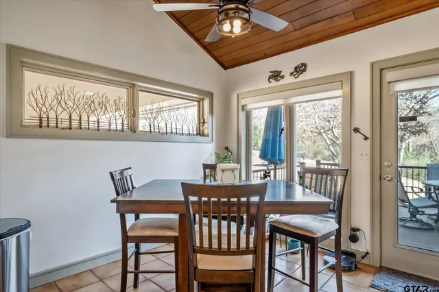 a kitchen with stainless steel appliances kitchen island granite countertop a refrigerator and a stove top oven