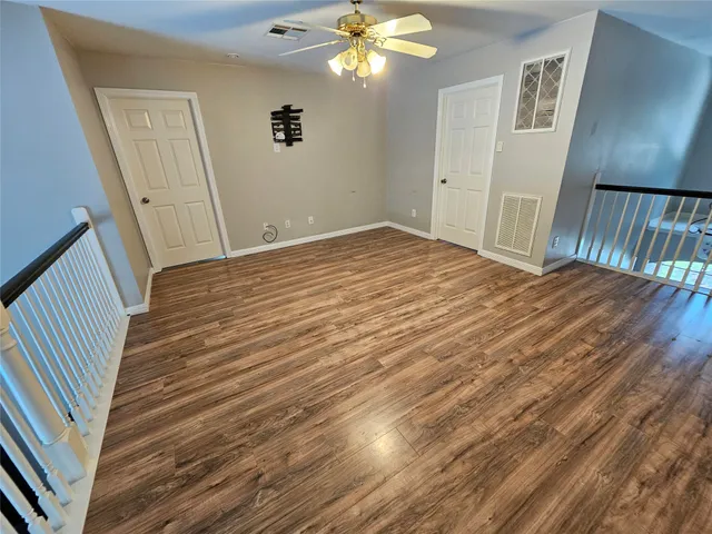 a view of a livingroom with wooden floor