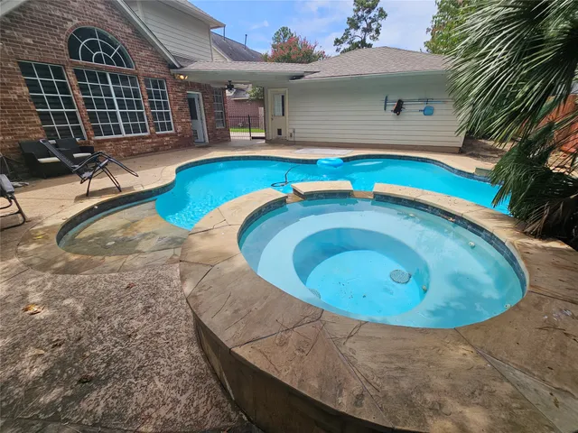 an aerial view of a house with swimming pool