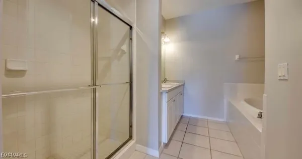 a bathroom with a bathtub and a shower
